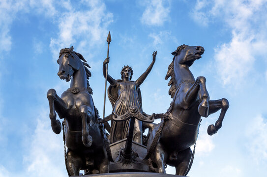 Bronze Boudica staue against summer sky in London, UK. This statue was commissioned in the 19th Century by Queen Victoria, and represents Boudica, or Boadicea, queen of the Celtic Iceni tribe.