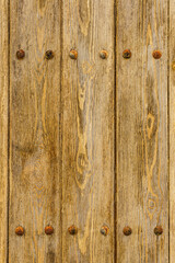 Old wooden background with rusty screws