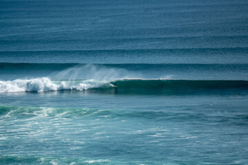 Surfer on perfect blue wave, in the barrel, clean water, Indian Ocean