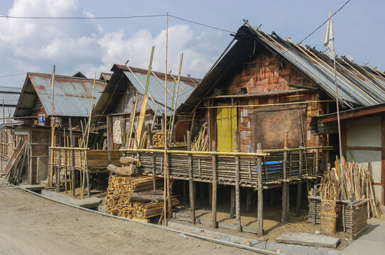 View of traditional wood and bamboo Apatani houses in tribal village on the Ziro plateau, Arunachal Pradesh, India