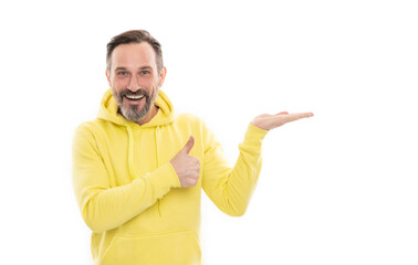 advisor man in yellow hoody. adult guy advertising. male casual sporty fashion. copy space. thumb up