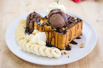honey Toast and ice cream on white dish wood table