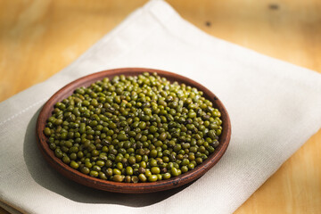 Mung bean is a legume native to Asia, small greenish pea beans. In Asia, for centuries, thick soups and strong aromatic cereals with spices have been cooked from it. High quality photo