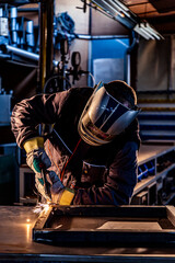 Fototapeta na wymiar A welder welding in factory