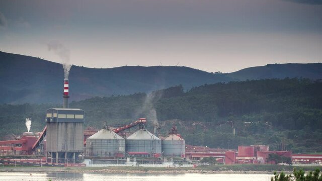 Industrial area on sea coast. Fabrica de Alumina Alcoa in Galicia Spain. Aluminum industry.