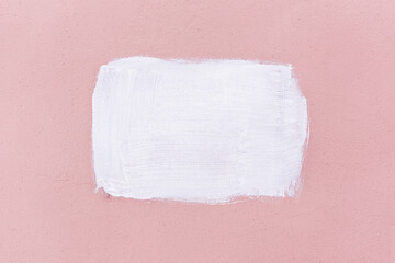 Abstract painted pink wall with white rectangle for lettering background