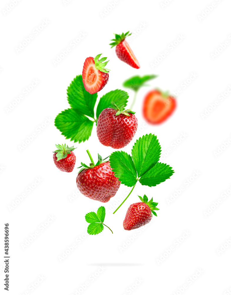 Wall mural ripe fresh flying red strawberry, green leaves isolated on white background. strawberry pattern summ