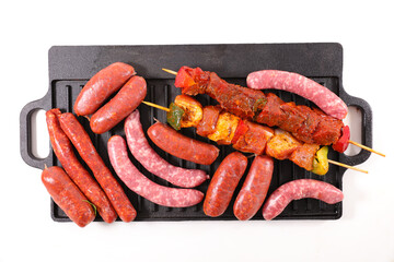 assorted of raw meats on grill