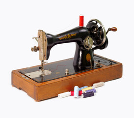 Old sewing machine isolated on white background