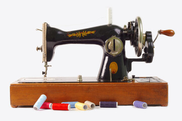 Old sewing machine isolated on white background