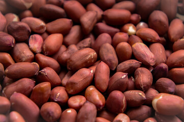 peanut fruit with red peel close-up background