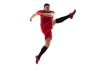 Powerful, flying above the field. Young football, soccer player in action, motion isolated on white background .