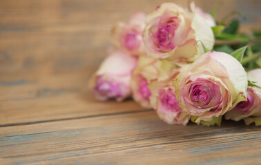 Pink roses on wood background. Mothers day roses, Bouquet of pink roses, Floral background image with copy space for text