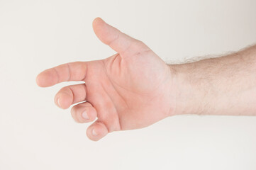 Close up male caucasian hand reach and ready to help or receive. Gesture on white background