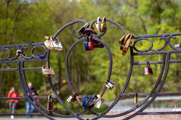 lovers' castles on the fence of the bridge