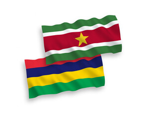 Flags of Republic of Suriname and Republic of Mauritius on a white background