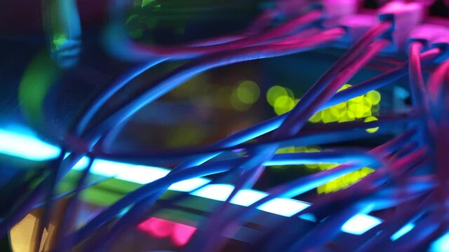 Close-up view of modern internet network switch with plugged ethernet cables. Blinking lights on internet server. Concept of data center. Cloud computing and telecommunications