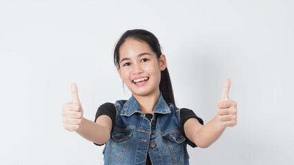 Asian Young woman gesture posing on white background. represent cheerful and confident. Showing gestures such as mini heart Okay Thumb up or point out. Happy amazed excited and surprised Jacket jeans.