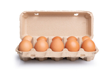 10 fresh eggs raw in a carton box on white background. Ten fresh chicken eggs