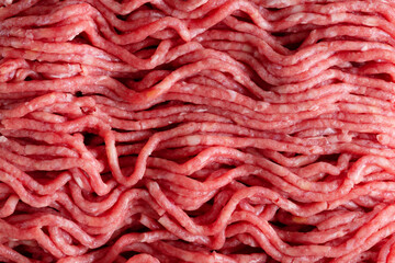 Minced meat with spices on table