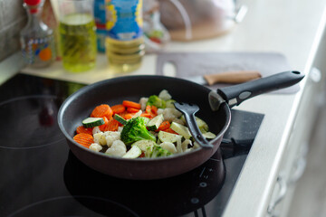 Fresh vegetables cooking on pan at home