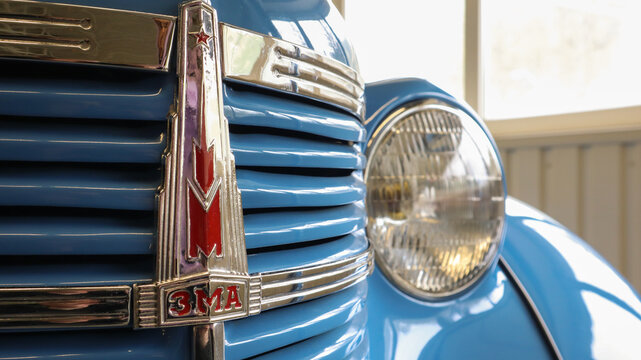 Soviet retro car Moskvich-401 passenger cabriolet blue close-up at the exhibition. The first mass-produced passenger car sold in the USSR. Ukraine, Kiev - June 10, 2021.