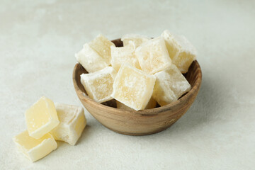 Bowl with turkish delight cubes on white textured background