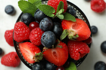 Bowl with berry delicious mix, close up
