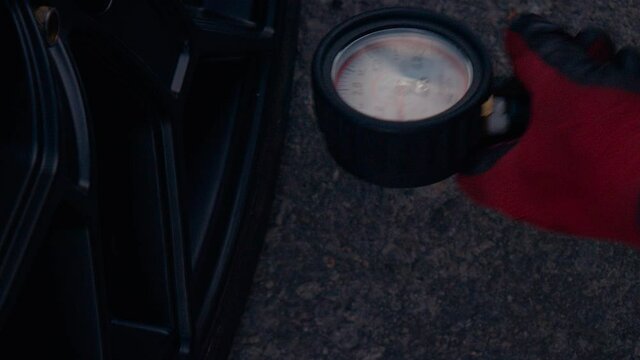 Auto Mechanic Was Checking Pressure.