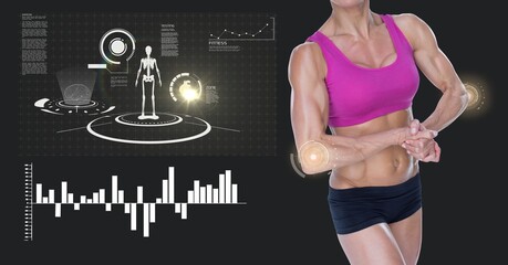 Mid section of caucasian female athlete flexing against digital interface with data processing