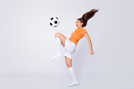 Full body photo of skilled lady soccer team player euro 2020 league game take ball on knee showing trick wear football uniform t-shirt shorts cleats socks isolated white color background