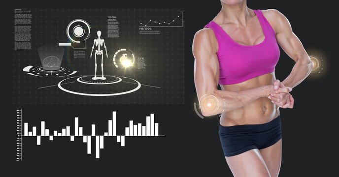 Mid section of caucasian female athlete flexing against digital interface with data processing