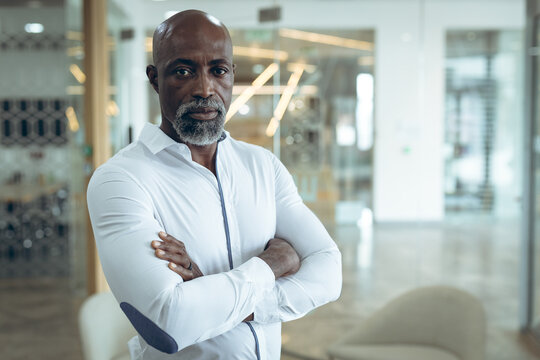 Portrait of african american businessman looking at camera with arms crossed