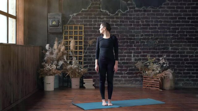 Woman Practicing Yoga Indoor Class. Stretching Exercise Day Light. Sport Fitness Health Caucasian Young Adult Female Showing Yoga Pose On Yoga Mat 