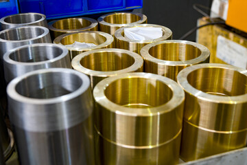 Hydraulic piston and cylinder on a rack in a warehouse.