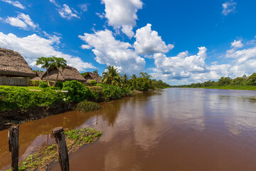 Palm Tree Roof Top Huts Along The Saramacca River In Groningen Suriname