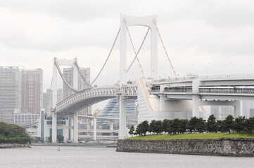 Rainbow bridge seen from the coast of Odaiba, with part of the Tokyo skyline in the background