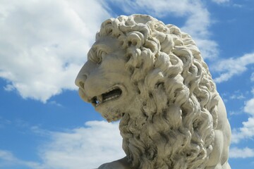 Fototapeta premium Lion sculpture in St Augustine city in Florida on blue sky background