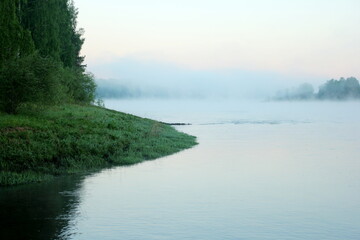Fog on the river early in the morning during the summer