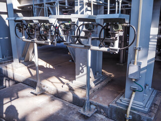 Temperature transmitter for measuring instrument close up in industry zone at power plant.