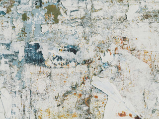 Vintage old posters stuck and torn on the wall in your grunge background