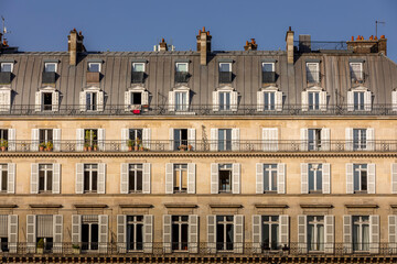 Fototapeta na wymiar Paris, France - March 31, 2021: Beautiful Parisian building near Tuileries garden in Paris