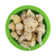 Top view of pickled cauliflower in a green bowl on a white background.