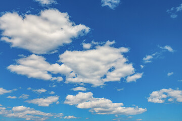 Naklejka na ściany i meble White clouds in the blue sky on sunny day