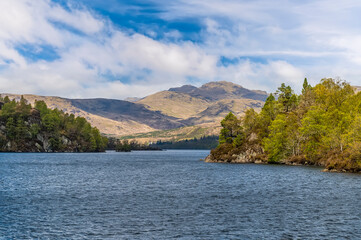 A view towards the western shore of Loch Katrine in the Scottish Highlands on a summers day