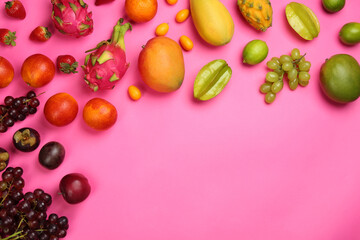 Many different delicious exotic fruits on pink background, flat lay. Space for text