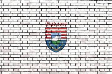 flag of Budaors painted on brick wall