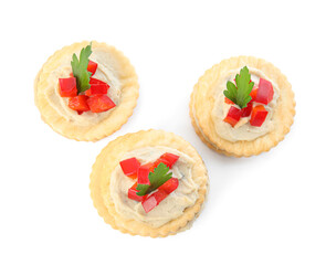 Delicious crackers with humus, bell pepper and parsley on white background, top view