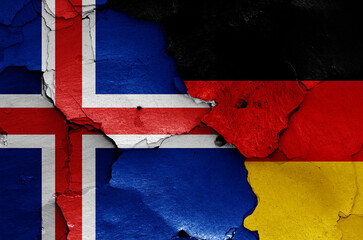 flags of Iceland and Germany painted on cracked wall