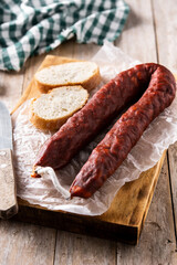 Spanish chorizo sausage on rustic wooden table	